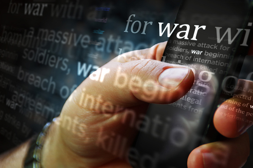 hand holding phone with "war" emboldened screen