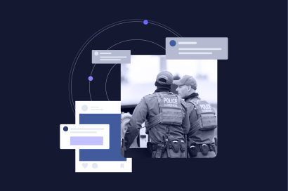 Two police officers observing a digital interface with various chat bubbles and icons, symbolizing online communication or monitoring.